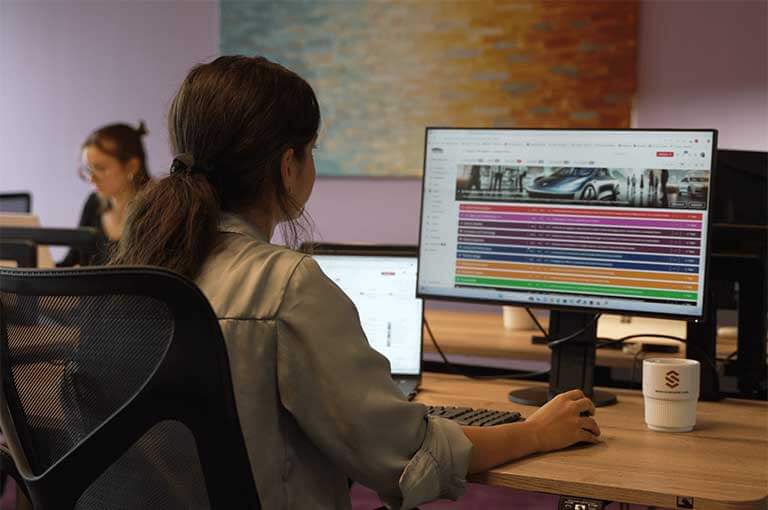 Content Management and Strategic Communication Workspace 13 Professional working in a digital workspace using content management software to facilitate strategic communication tasks daily.